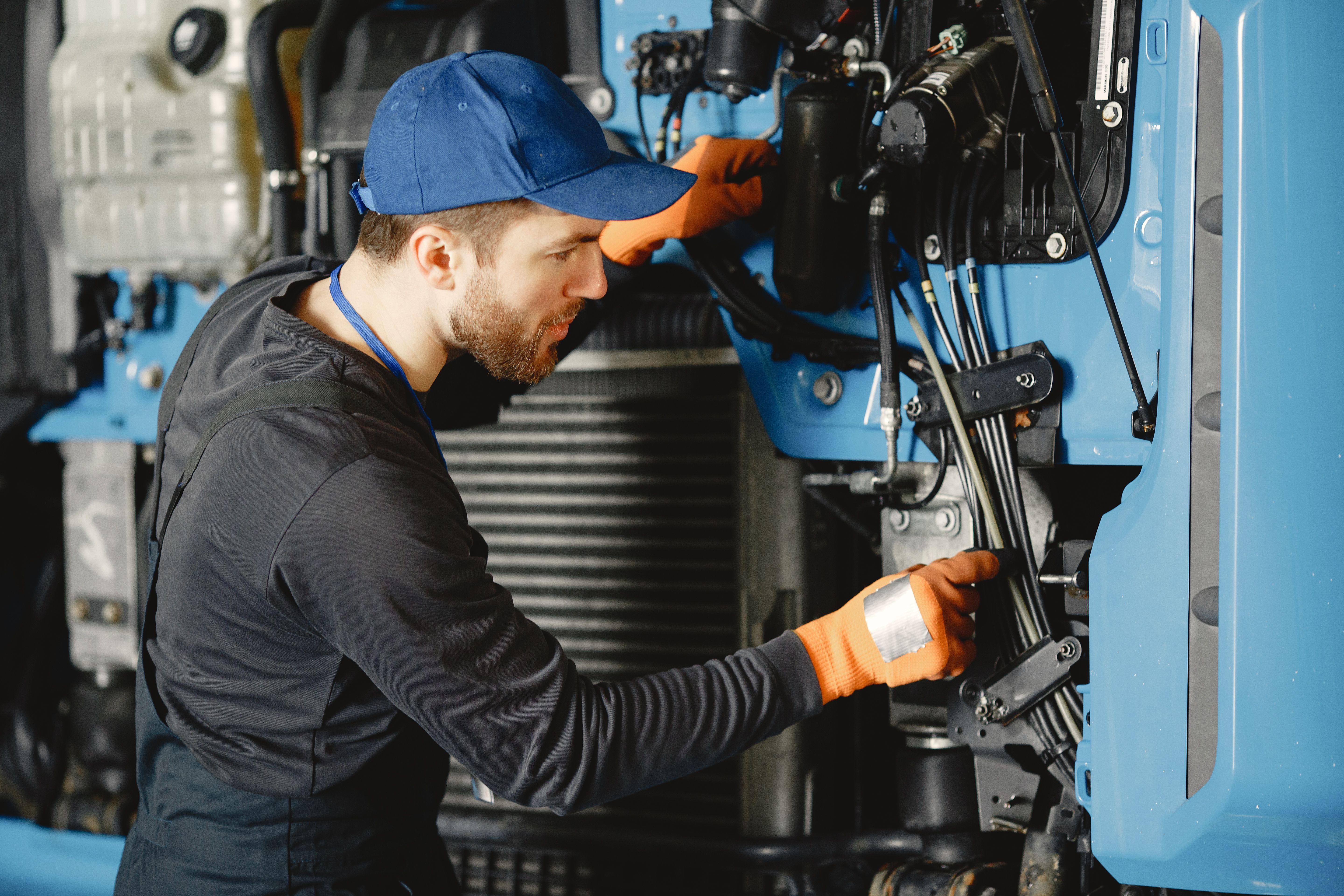 Mechanic servicing heavy equipment